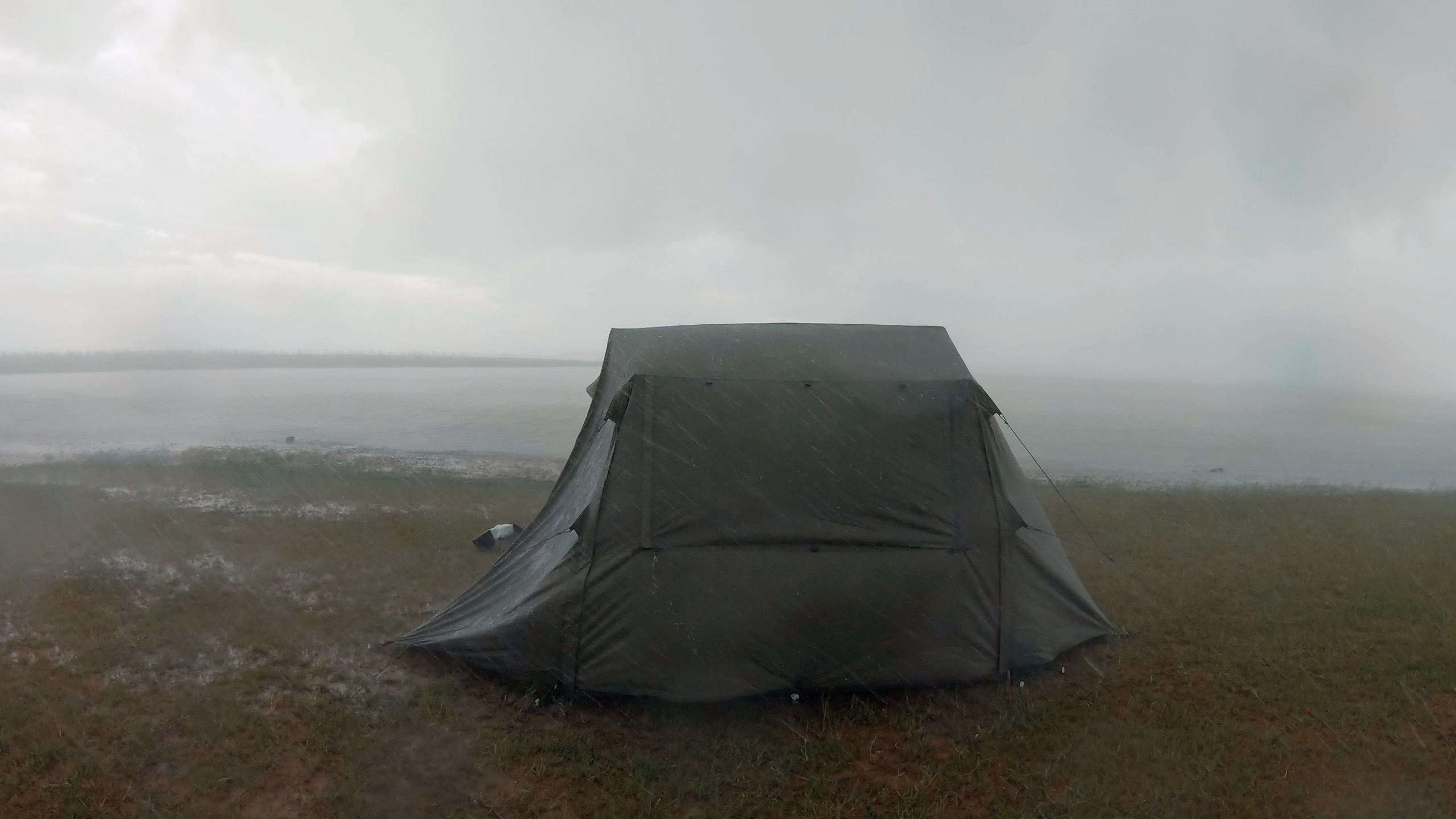 A supplied photo shows Thong camping under the rain.