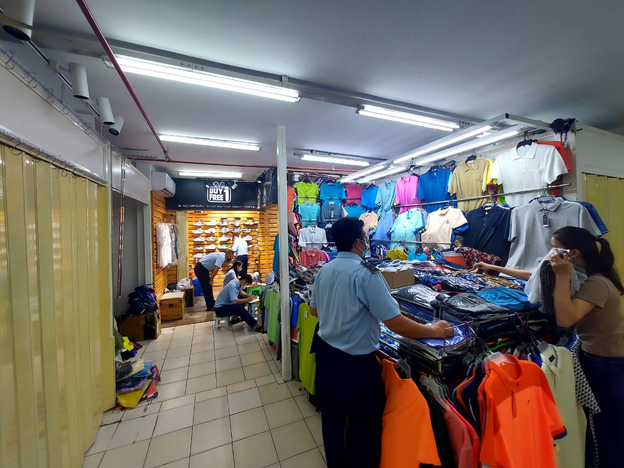 This supplied photo shows market watchdog officers examine a store at Saigon Square in District 1, Ho Chi Minh City, November 1, 2022.