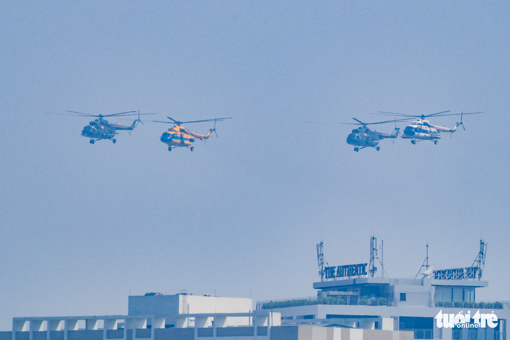 Four Mi helicopters fly in formation in Long Bien District, Hanoi as part of flight drills to prepare for the Vietnam International Defense Expo 2022, November 3, 2022. Photo: Nam Tran / Tuoi Tre
