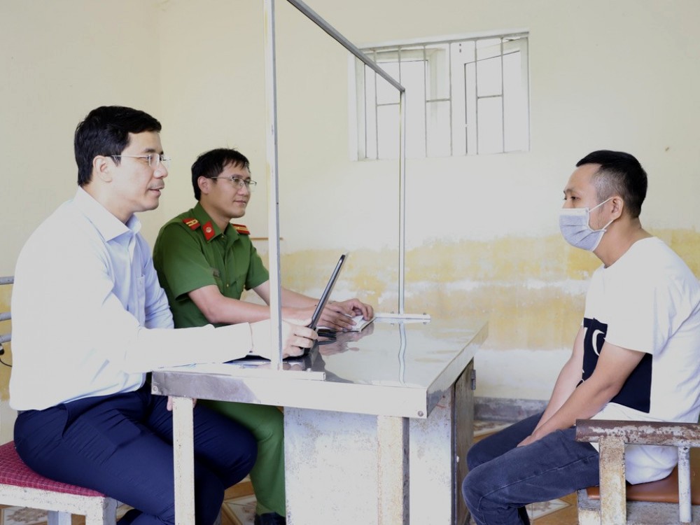 Tran Quang Nam, the ring leader, at the police station in this photo supplied by officers