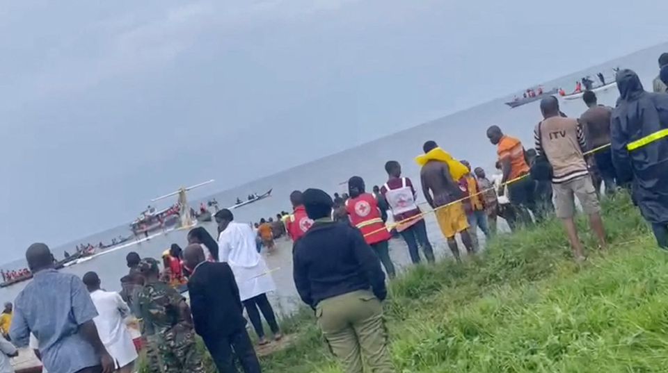People look at Precision Air plane that crushed into Lake Victoria, Tanzania, in this still image obtained from a social media video. Kanyika/ @startvtanzania1/via Reuters