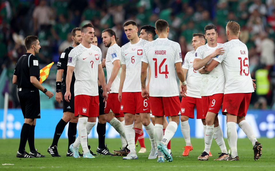 Poland's Robert Lewandowski with teammates after the match. Photo: Reuters
