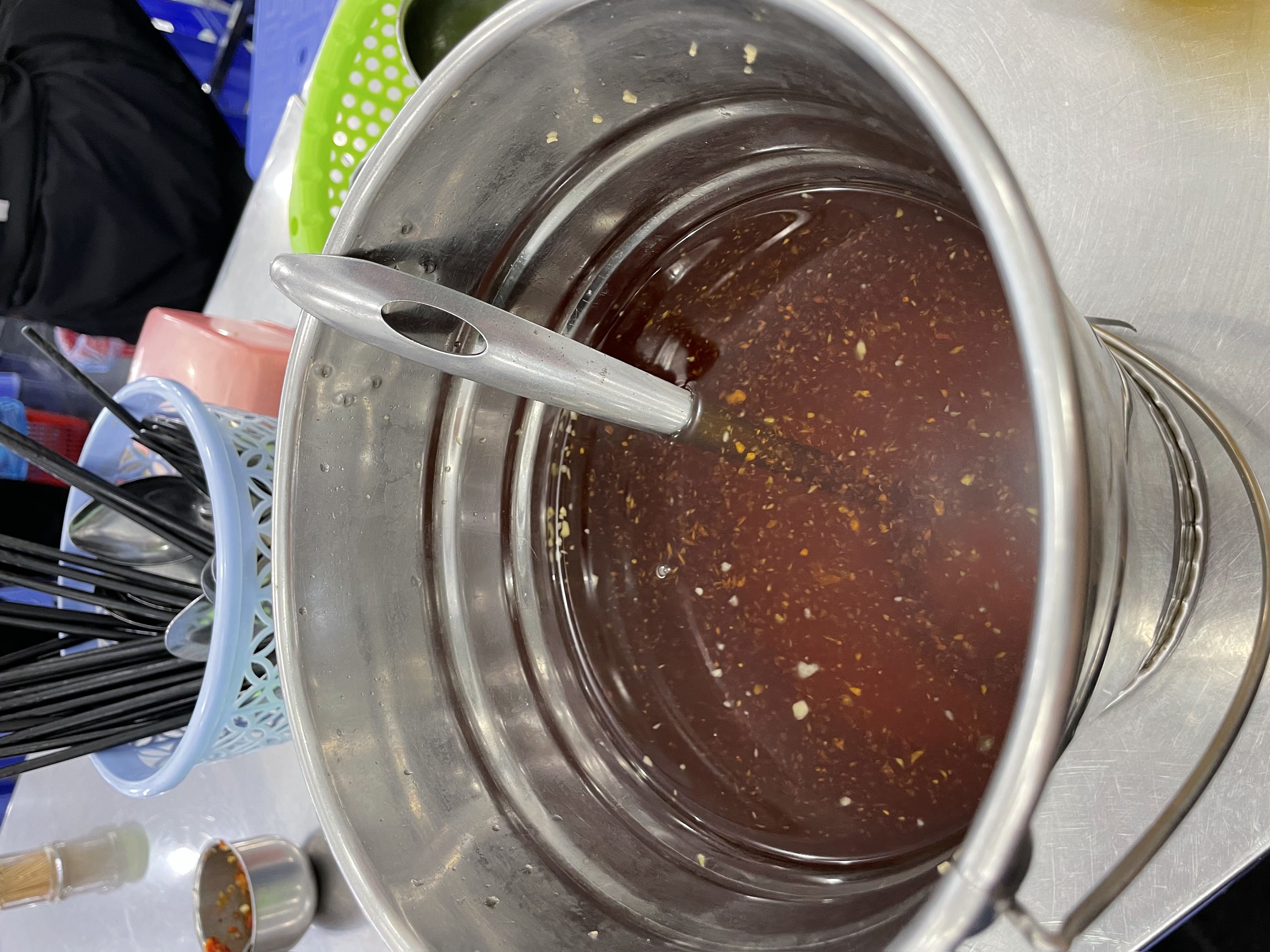 A bucket of sweet and sour fish sauce seen at Kieu Bao, a 'bún thịt nướng' restaurant with six branches across Ho Chi Minh City. Photo: Cassanda Cassidy / Tuoi Tre News