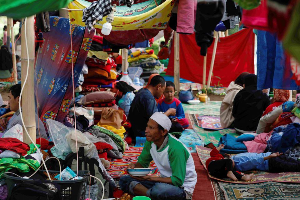 Locals are sheltered in a makeshift tent after Monday's earthquake hit Cianjur, West Java province, Indonesia, November 24, 2022. Photo: Reuters