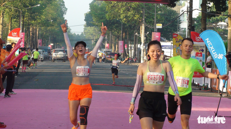 Other female participants with smiles on their faces