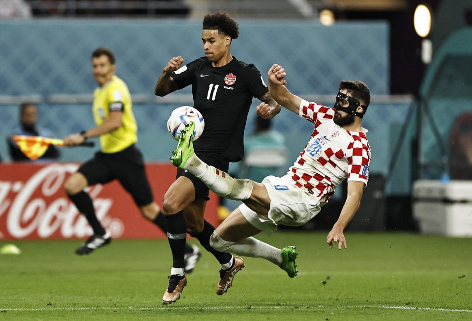 Soccer Football - FIFA World Cup Qatar 2022 - Group F - Croatia v Canada - Khalifa International Stadium, Doha, Qatar - November 27, 2022 Croatia's Josko Gvardiol in action with Canada's Tajon Buchanan. Photo: Reuters