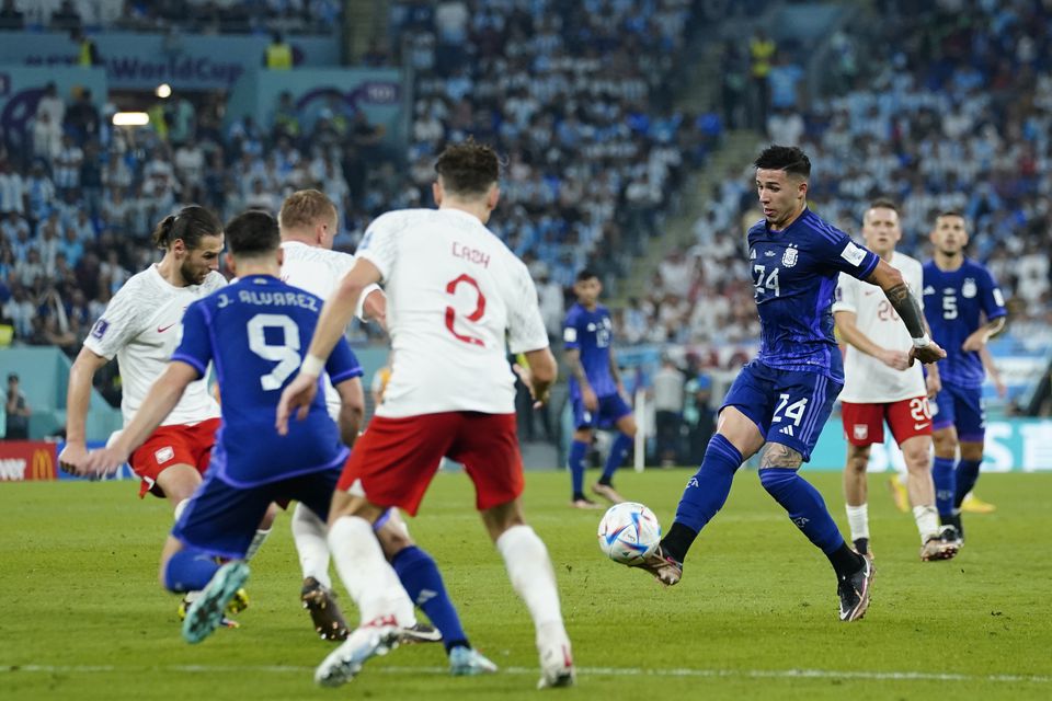Nov 30, 2022; Doha, Qatar; Argentina midfielder Enzo Fernandez (24) passes the ball to forward Julian Alvarez (9) during the second half against Poland in a group stage match during the 2022 World Cup at Stadium 974. Photo: Danielle Parhizkaran-USA TODAY Sports