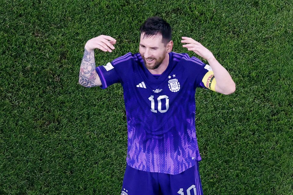 Soccer Football - FIFA World Cup Qatar 2022 - Group C - Poland v Argentina - Stadium 974, Doha, Qatar - November 30, 2022 Argentina's Lionel Messi celebrates after the match as Argentina qualify for the knockout stages. Photo: Reuters