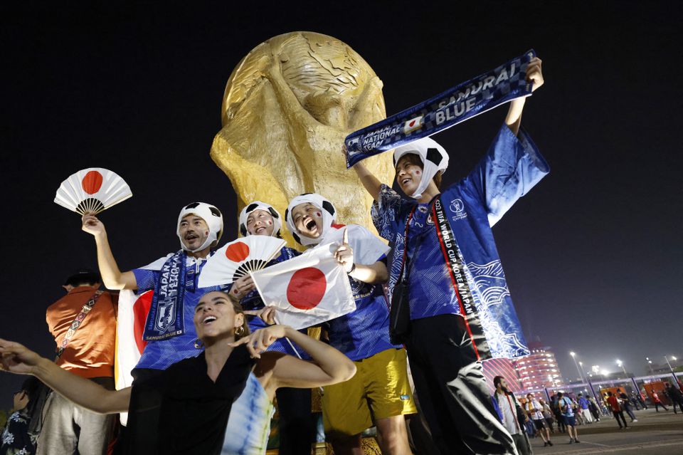 Soccer Football - FIFA World Cup Qatar 2022 - Group E - Japan v Spain - Khalifa International Stadium, Doha, Qatar - December 2, 2022 Japan fans celebrate outside the stadium after the match as Japan qualify for the knockout stages. Photo: Reuters