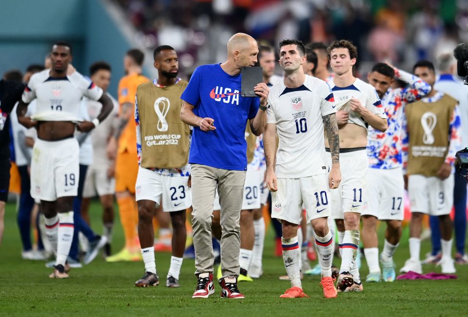 Soccer Football - FIFA World Cup Qatar 2022 - Round of 16 - Netherlands v United States - Khalifa International Stadium, Doha, Qatar - December 3, 2022 U.S. coach Gregg Berhalter and Christian Pulisic of the U.S. look dejected after the match as United States are eliminated from the World Cup. Photo: Reuters