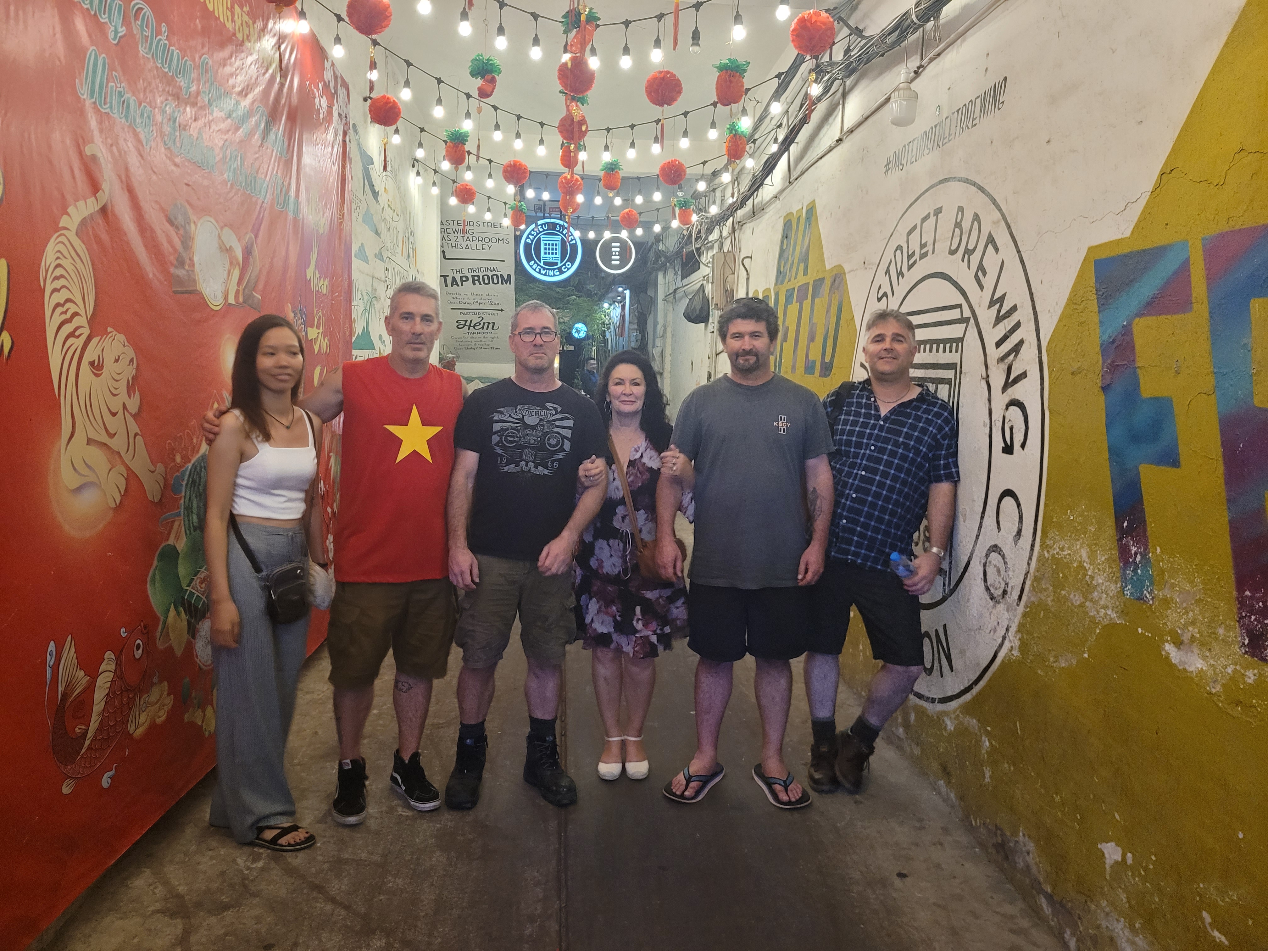 Gavin (second from left) and his family pose for a photo while visiting some of the exciting nightspots in Ho Chi Minh City. Photo: Ray Kuscherts