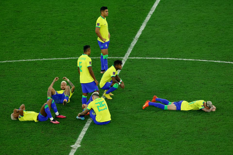 Soccer Football - FIFA World Cup Qatar 2022 - Quarter Final - Croatia v Brazil - Education City Stadium, Doha, Qatar - December 9, 2022 Brazil players look dejected after being eliminated from the World Cup REUTERS/Lee Smith