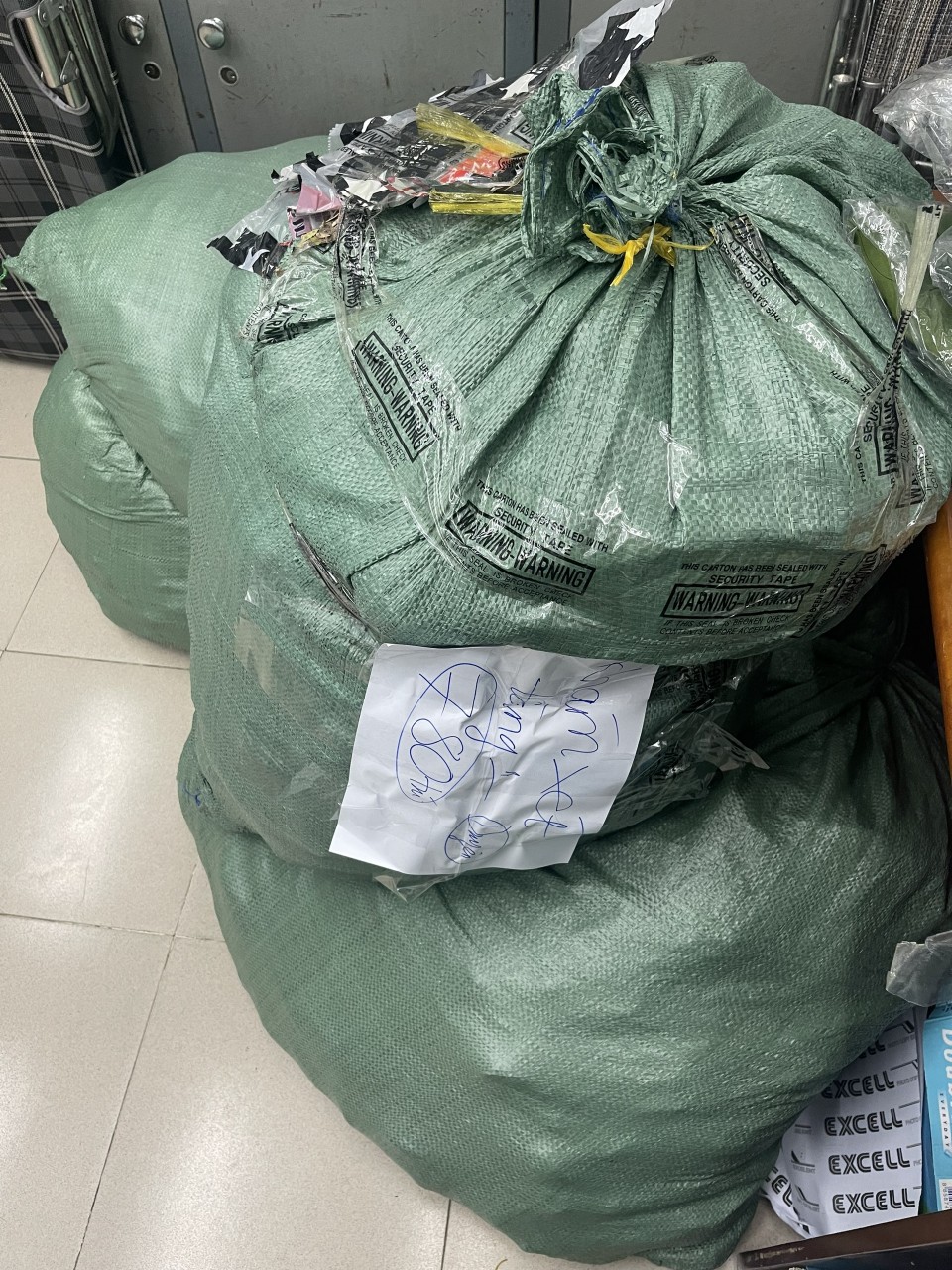 This supplied photo shows sacks of handbags stolen from a warehouse at Tan Son Nhat International Airport in Ho Chi Minh City.