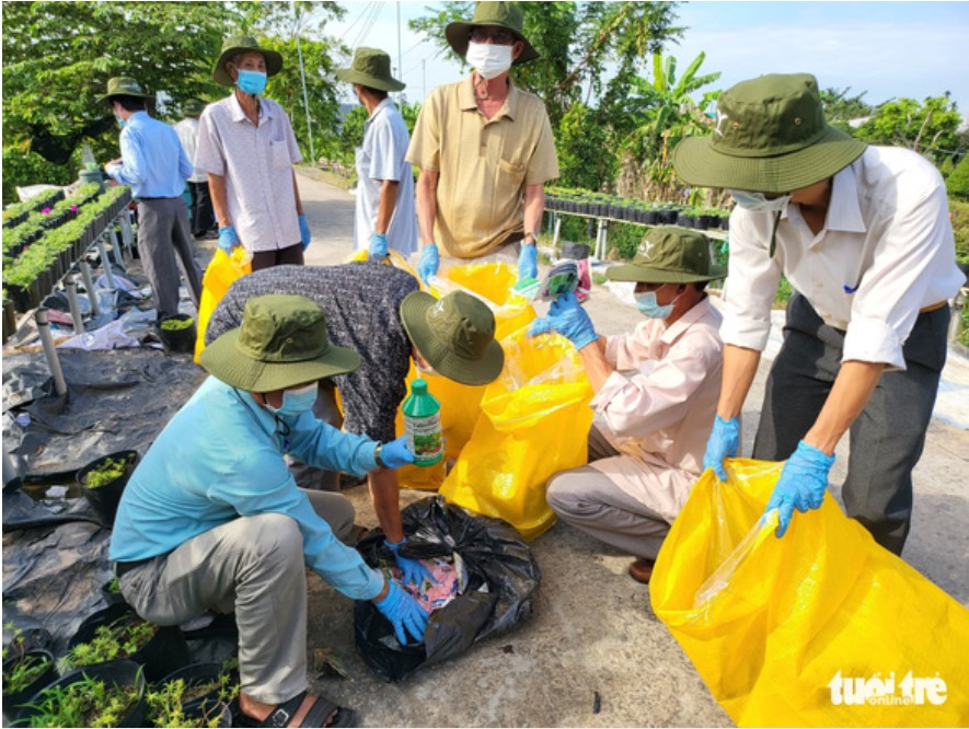 In southern Vietnam, farmers trade empty pesticide packaging for essential goods