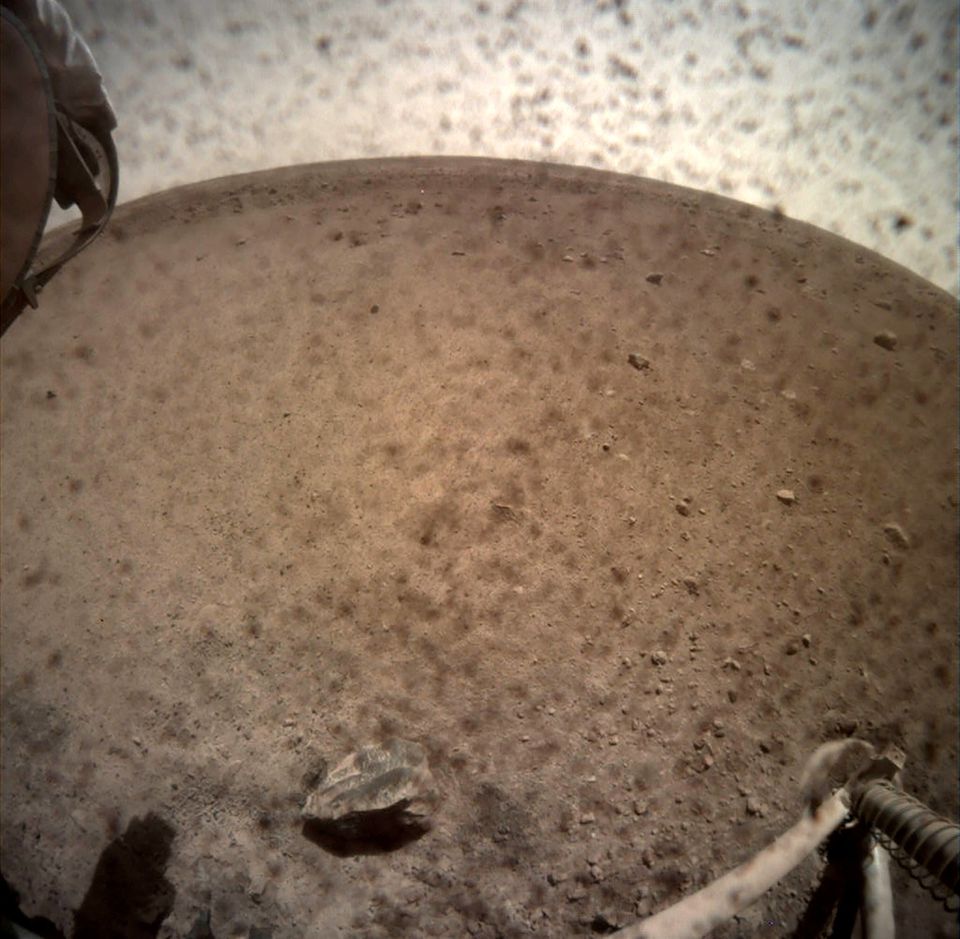 An image acquired by NASA's InSight Mars lander shows the area in front of the lander using its lander-mounted, Instrument Context Camera (ICC) on Mars November 30, 2018. Image acquired November 30, 2018. NASA/JPL-Caltech/Handout via REUTERS