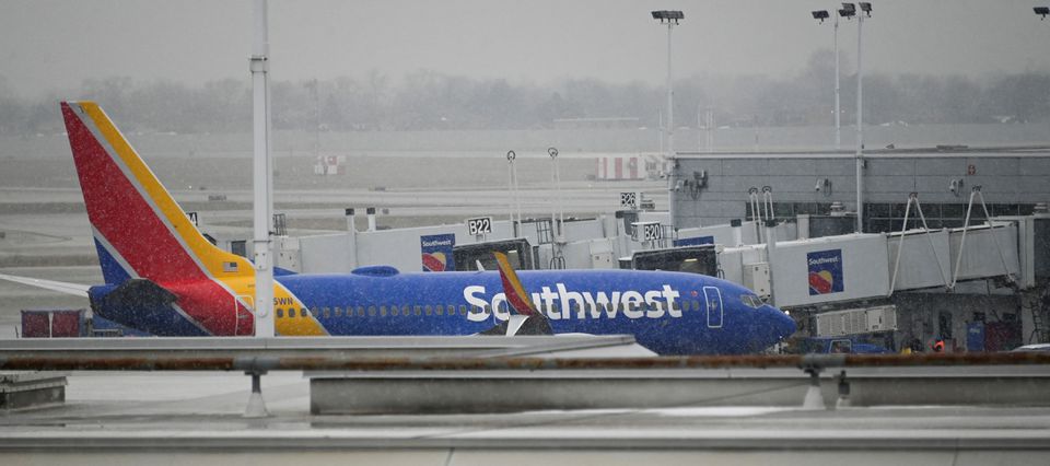 A plane sits on the airfield as flight cancellations mount during a cold weather front as a weather phenomenon known as a bomb cyclone hits the Upper Midwest, at Midway International Airport in Chicago, Illinois, U.S., December 22, 2022. Photo: REUTERS