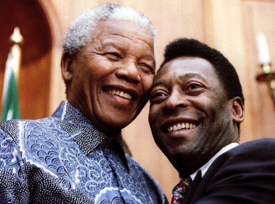 President Nelson Mandela and Brazilian soccer legend Pele smile for photographers at Union Buildings in Pretoria, South Africa, March 24, 1995. REUTERS/Juda Ngwenya