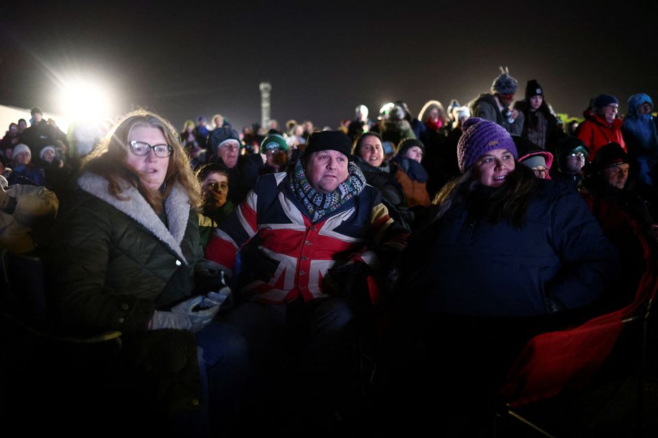 People watch Britain's first satellite launch on a screen, at Cornwall Airport Newquay, in Cornwall, Britain January 9, 2023.  Photo: Reuters