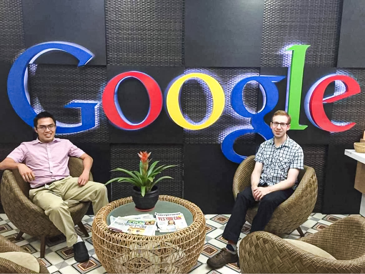 Huy Nguyen (left) sits next to one of his coworkers in a provided photo when he was still working at Google.