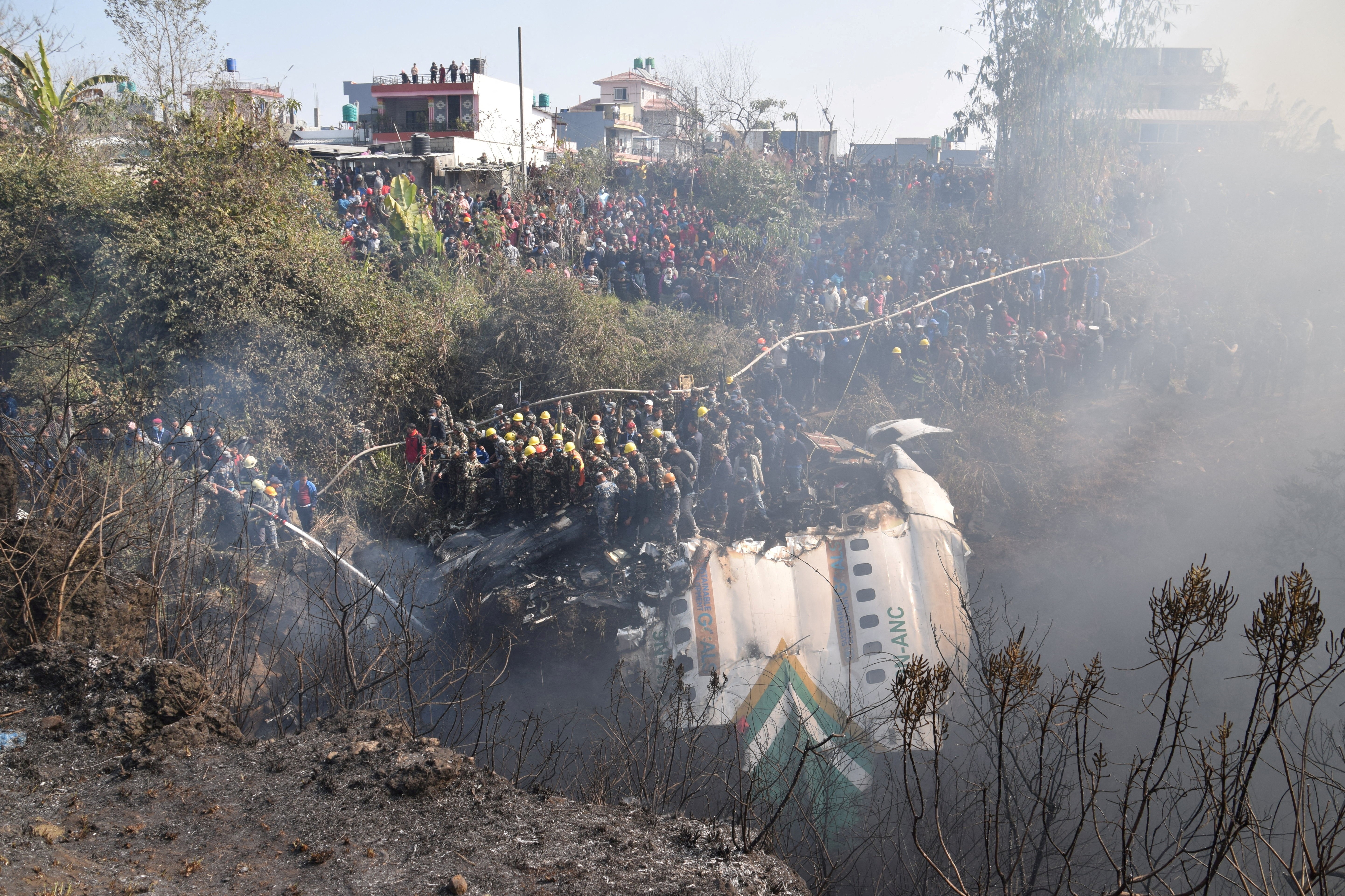 Rescue teams work to retrieve bodies from the wreckage at the crash site of an aircraft carrying 72 people in Pokhara in western Nepal January 15, 2023. Photo: Reuters