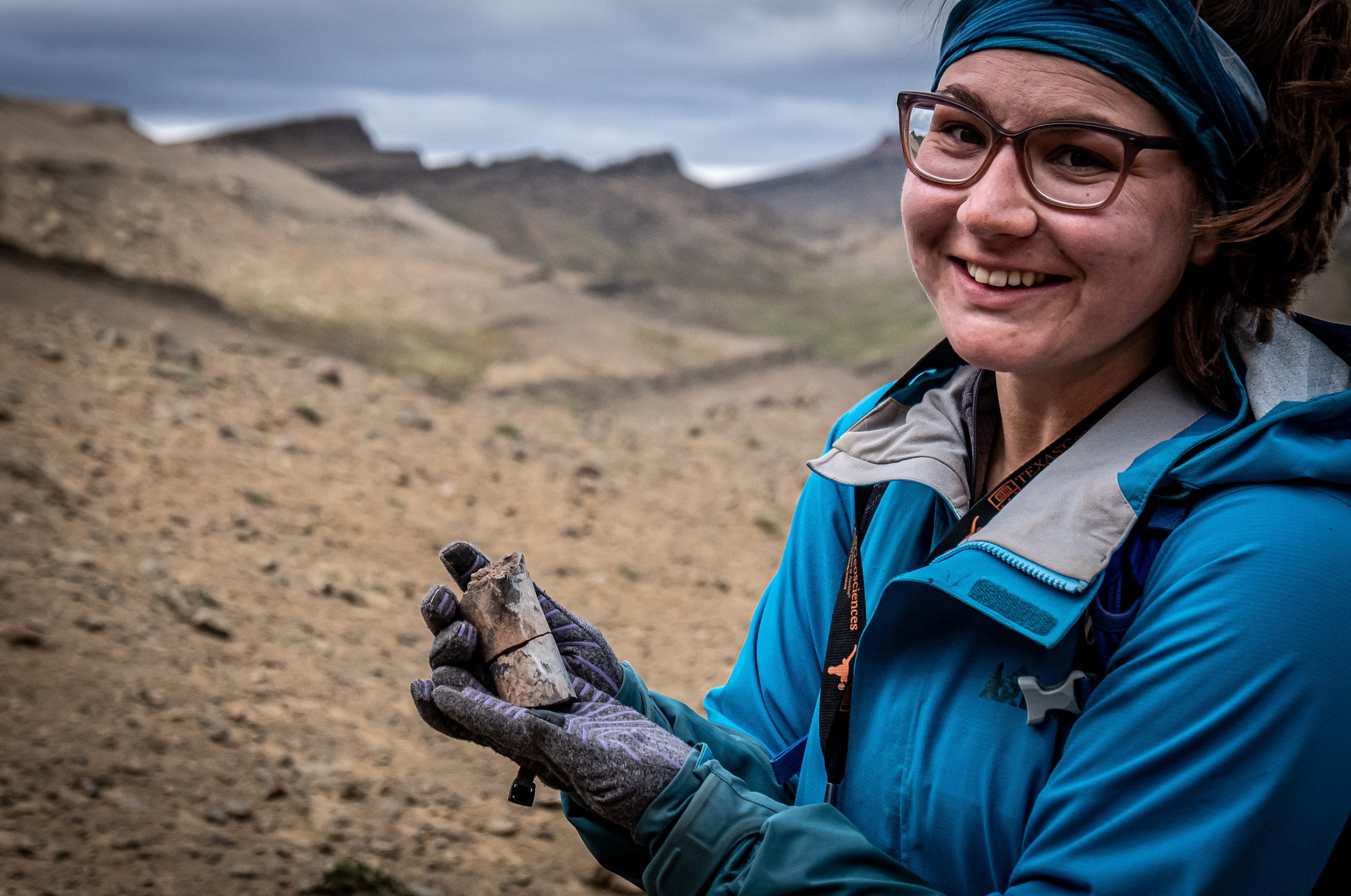 A woman holds a fossil at the area where scientists discovered megaraptor fossils at 'Guido' hill in the Chilean Patagonia area, close to Torres del Paine park, in Magallanes and Antarctic region, Chile in this undated handout photo provided by the Instituto Chileno Antartico on January 16, 2023. Photo: Reuters