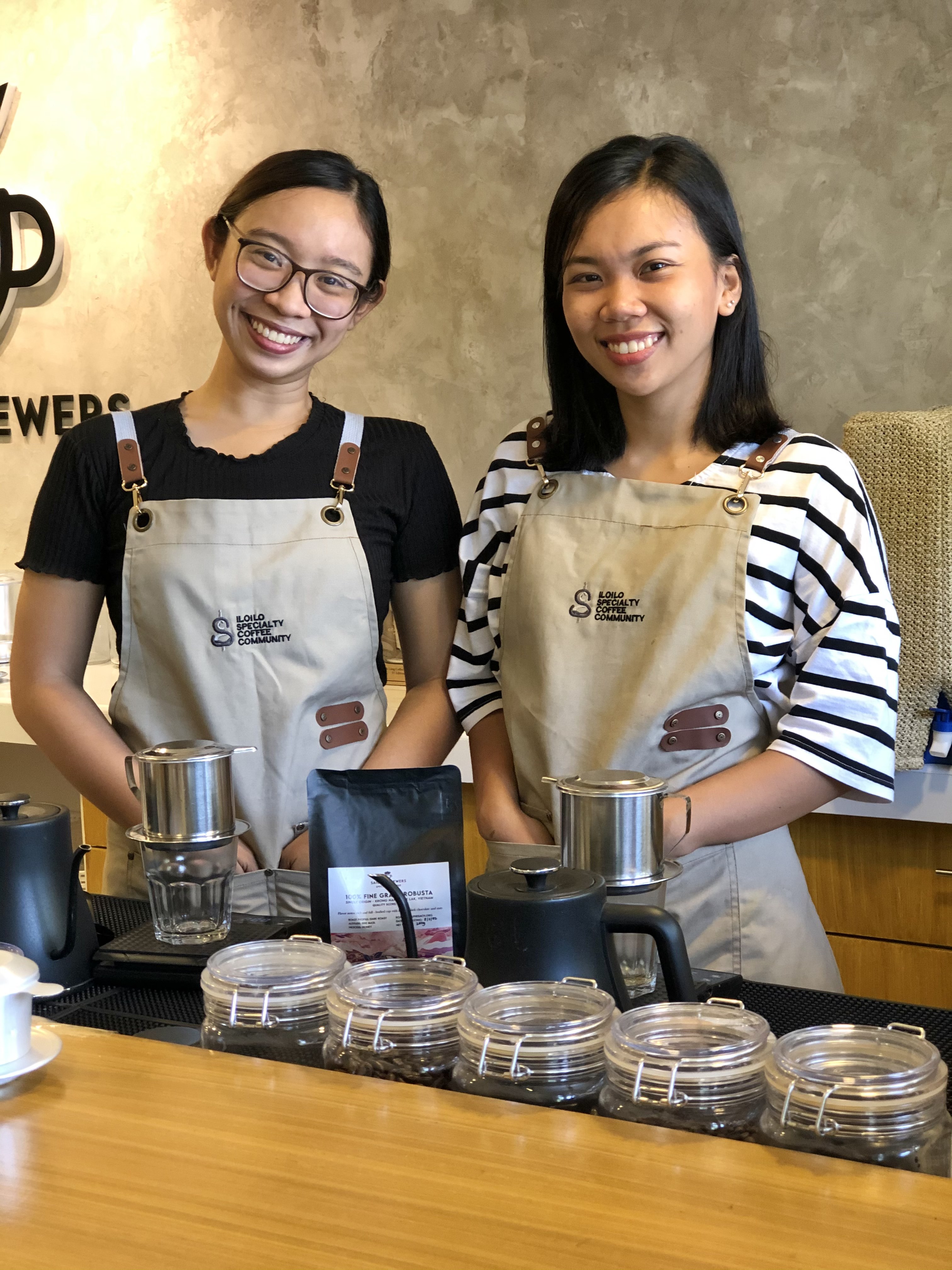 Ly-An Luz Jalandoni (right) and Chareese Angela Abat pose while making Vietnamese coffee at Saigon Brewers in this supplied photo.