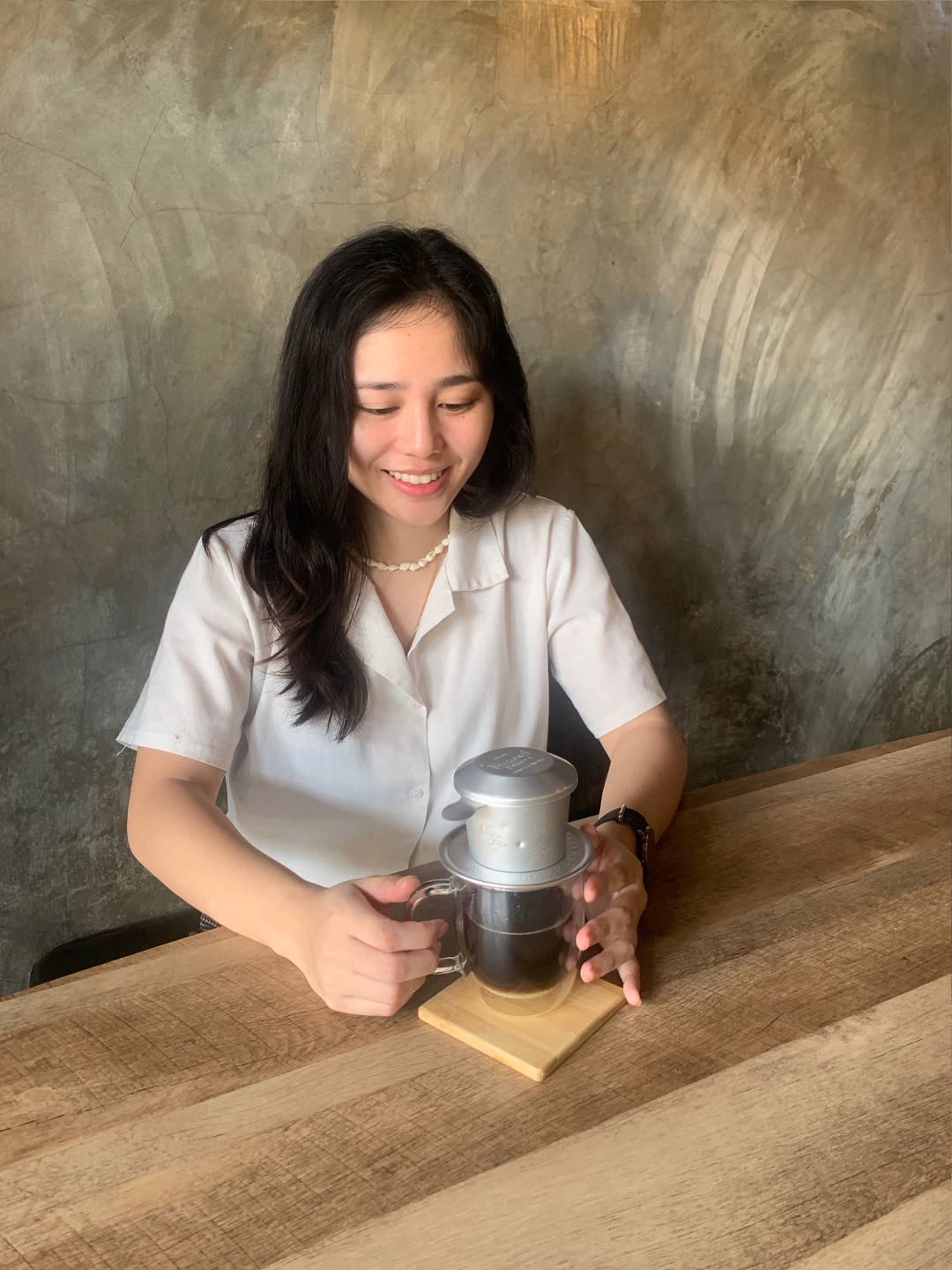 Kisha Ann Uygen, owner of Ponte Café, brews Vietnamese coffee with phin filter in this supplied photo.