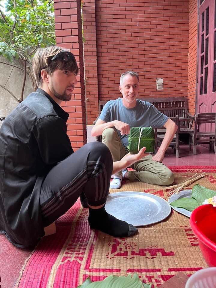 Officers of the Embassy of Canada in Vietnam make banh chung with Vietnamese people. Photo: Embassy of Canada in Vietnam