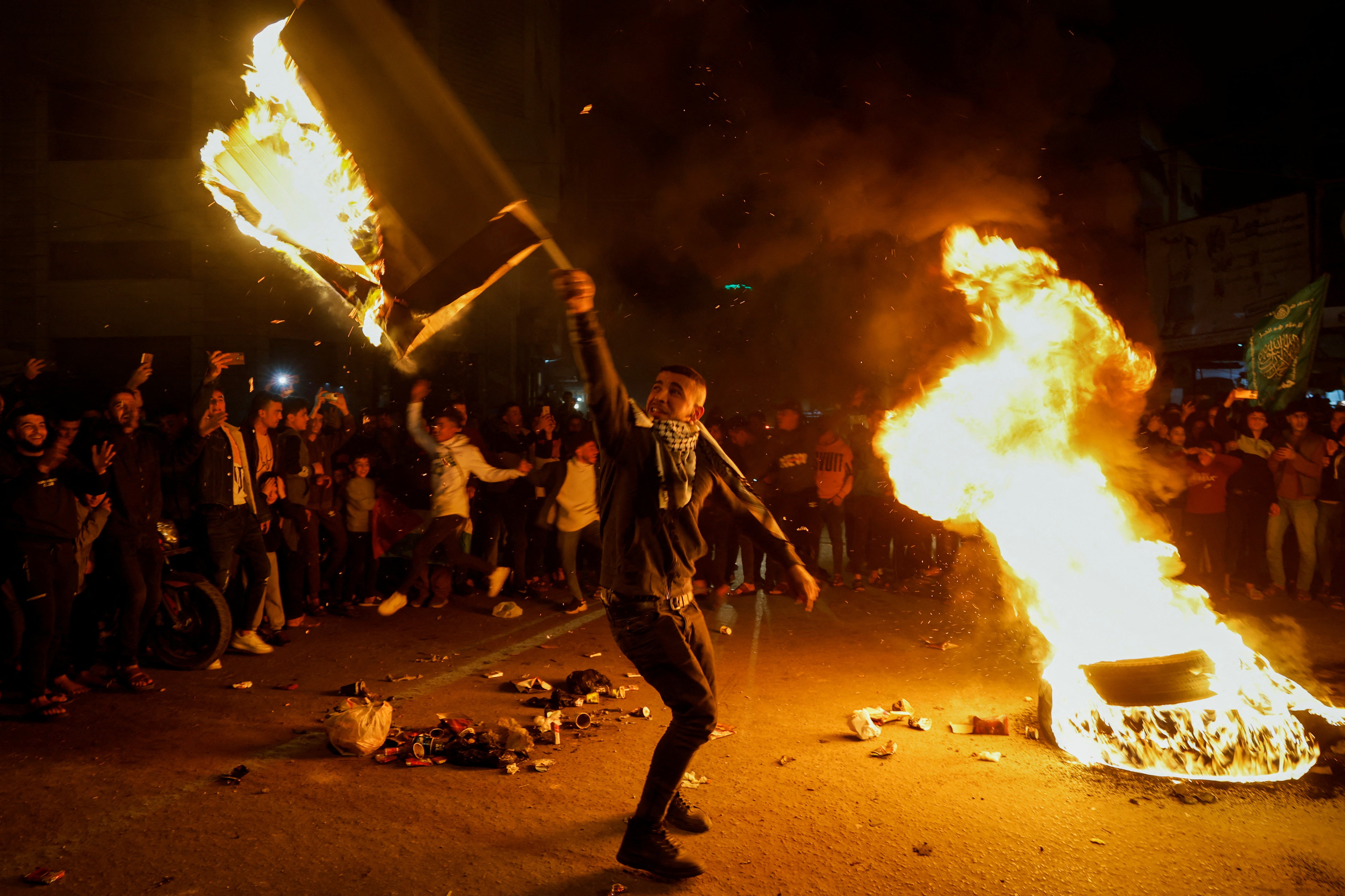 Palestinians celebrate following Jerusalem's shooting attack, in Gaza City January 27, 2023. Photo: Reuters