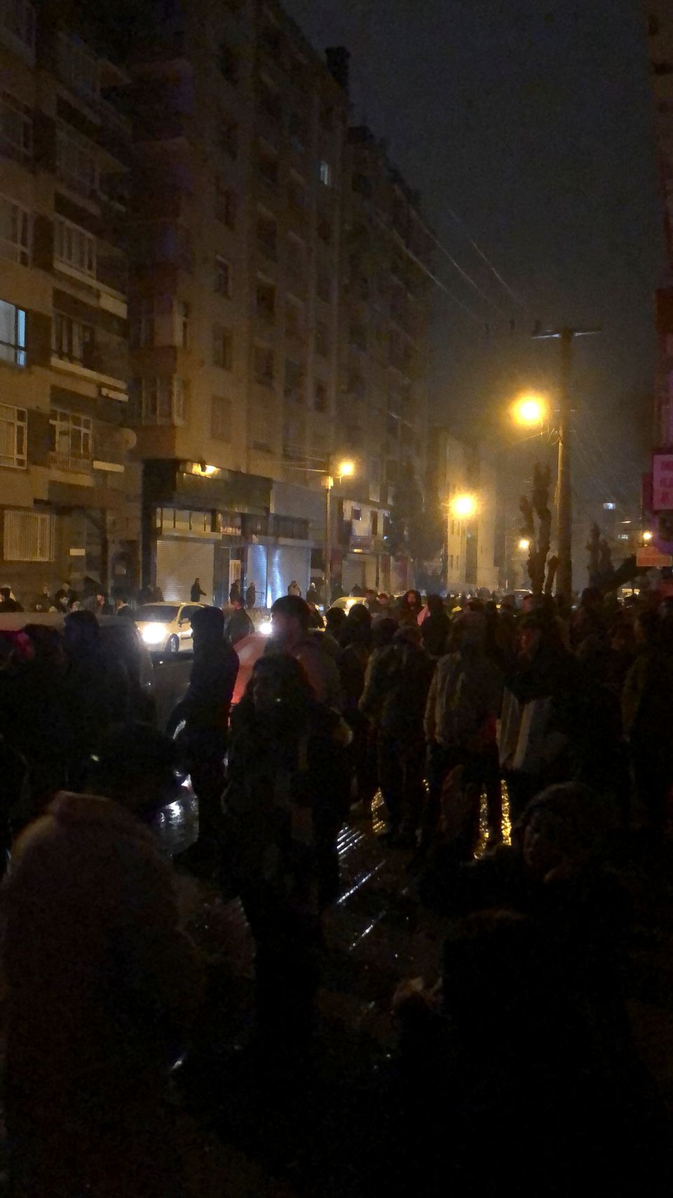 People gather, out in the open, after an earthquake of magnitude 7.9 struck southern Turkey, in Diyarbakir, Turkey February 6, 2023 in this picture obtained from social media. Aslan Avda/via Reuters