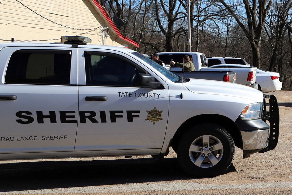 A vehicle of the Tate County Sheriff is seen parked outside a gas station convenience store after a shooting, in Arkabutla, Mississippi, U.S. February 17, 2023. Photo: Reuters