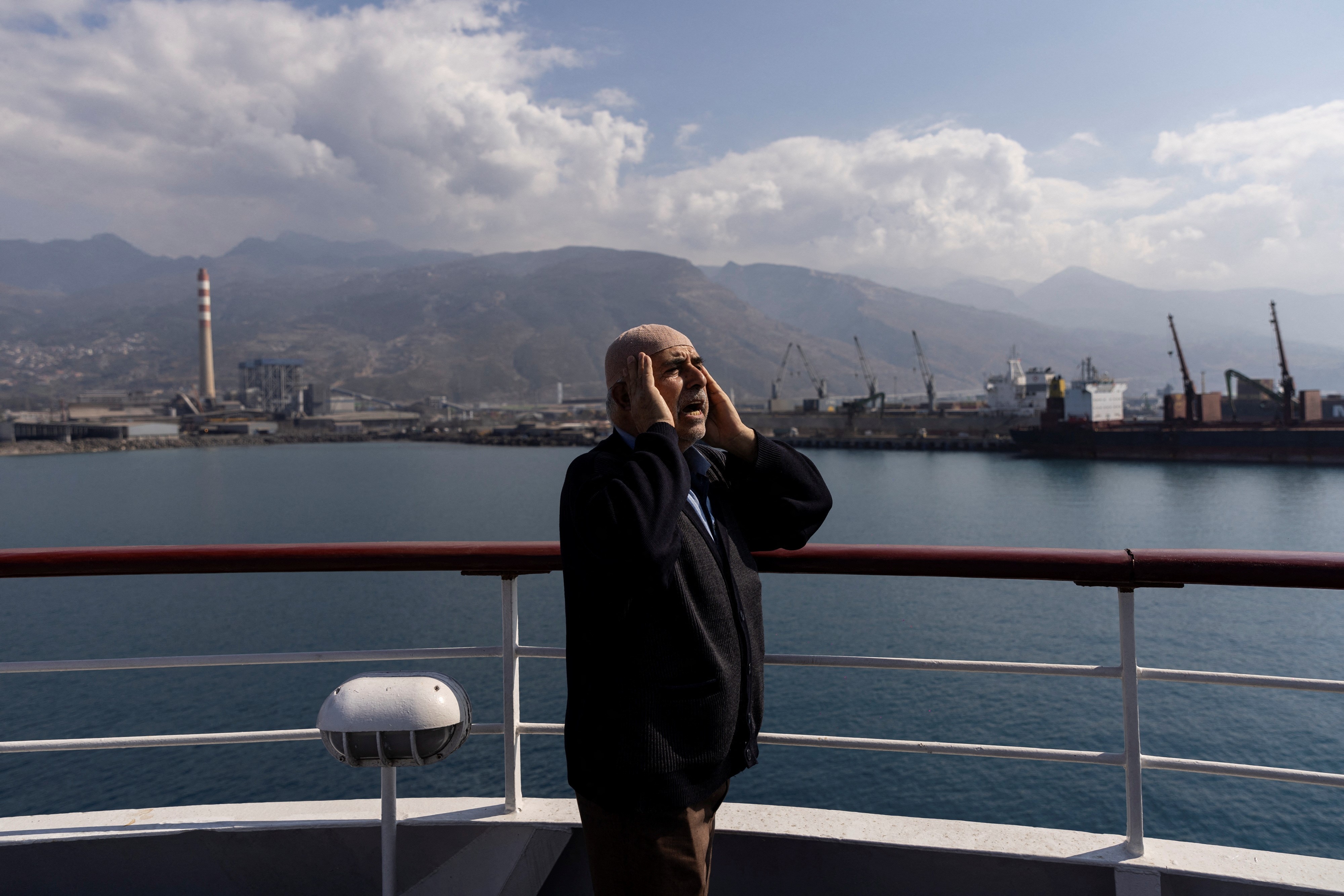 A Muslim man calls people to prayer on a cruise ship that serves as a temporary shelter for victims of the deadly earthquake in Iskenderun, Turkey, February 23, 2023. Photo: Reuters