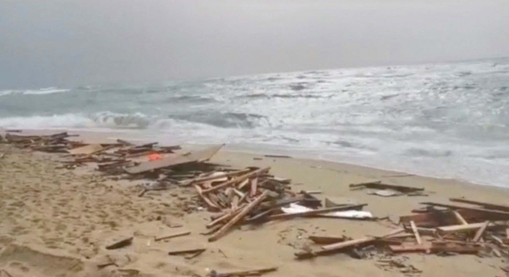 A screengrab taken from a video shows the beach where bodies of suspected to be refugees were found after a shipwreck, in Cutro, the eastern coast of Italy's Calabria region, Italy, February 26, 2023. Photo: Reuters