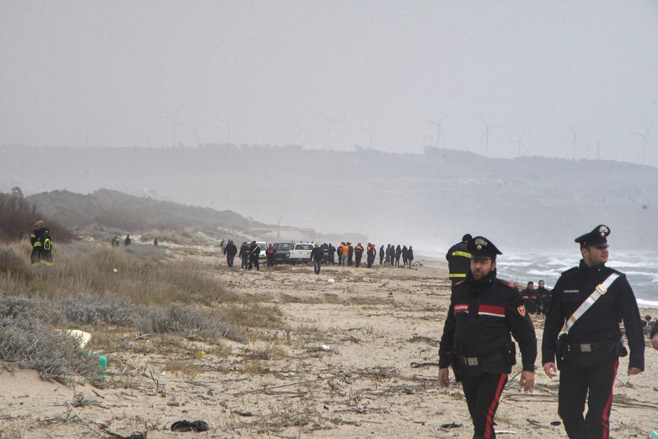Carabinieri officers work at the beach where bodies believed to be of refugees were found after a shipwreck, in Cutro, the eastern coast of Italy’s Calabria region, Italy, February 26, 2023. Photo: Reuters