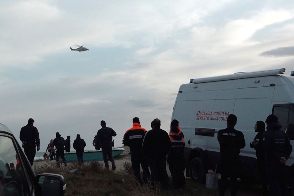 Rescuers work at the beach where bodies of refugees were found after a shipwreck, in Cutro, the eastern coast of Italy's Calabria region, Italy, February 26, 2023, in this screen grab taken from a Reuters TV video. Photo: Reuters