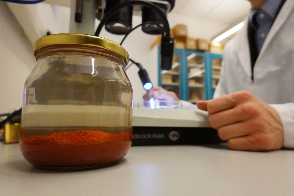 A jar containing saffron preserved in water that was retrieved from the wreck of a 15th century Danish warship, the Gribshunden, after more than 500 years on the seabed, sits in a laboratory in Lund University, Denmark, March 2, 2023. Photo: Reuters