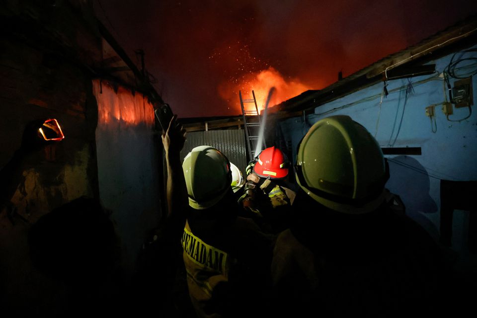 Firefighters try to extinguish a fire at a fuel storage station operated by Indonesia's state energy company Pertamina, in Jakarta, Indonesia, March 3, 2023. Photo: Reuters