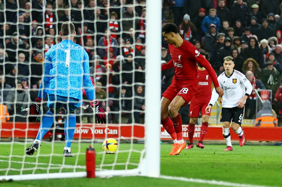 Soccer Football - Premier League - Liverpool v Manchester United - Anfield, Liverpool, Britain - March 5, 2023 Liverpool's Cody Gakpo scores their third goal past Manchester United's David de Gea. Photo: Reuters