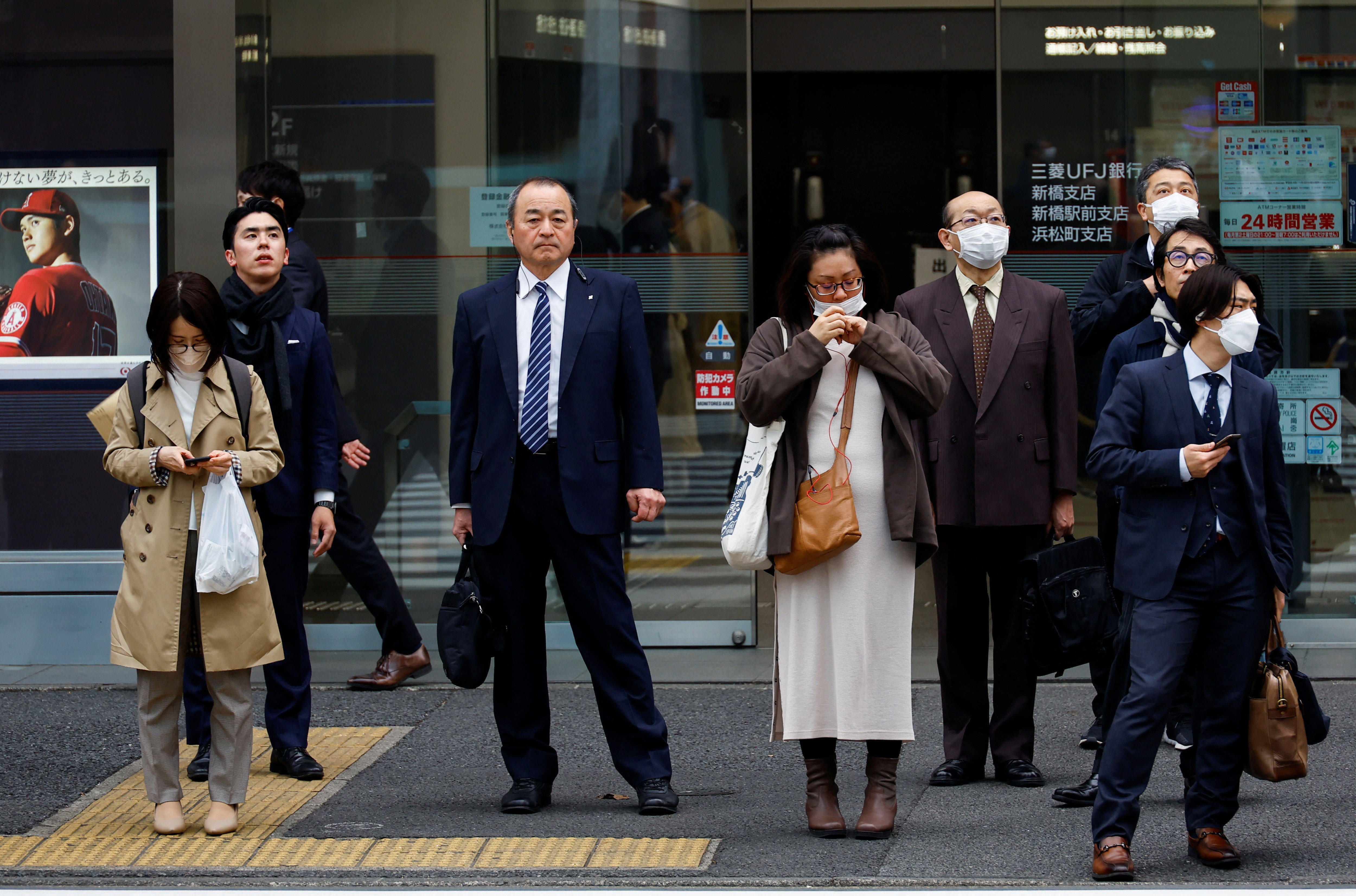 Commuters make their way on the first day of the Japanese government's relaxation of official guidance on masks as it emerges from the COVID-19 pandemic, in Tokyo, Japan March 13, 2023. Photo: Reuters