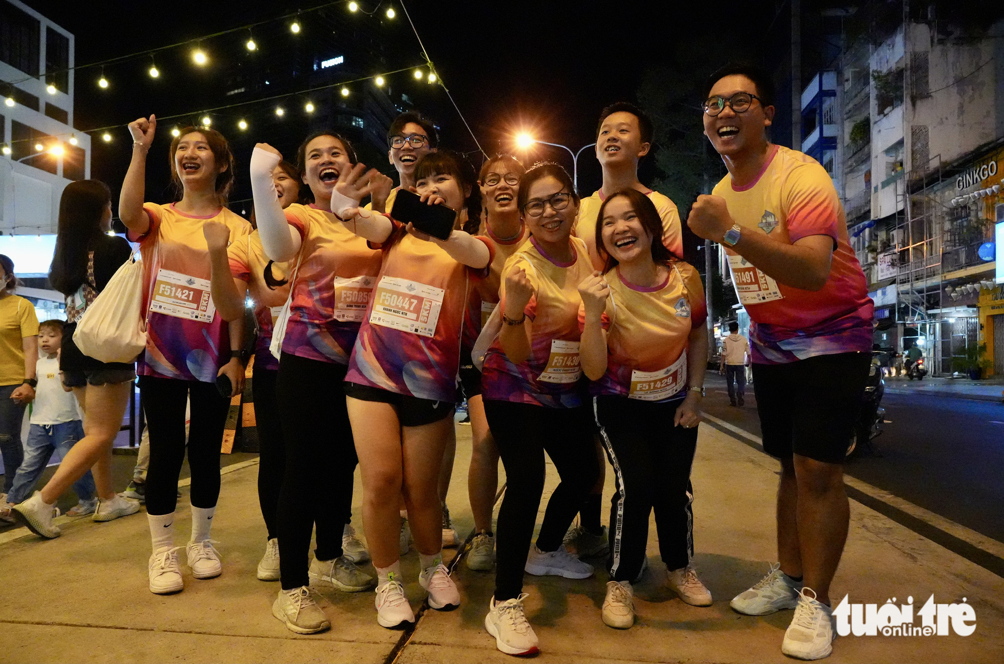 A group of participants pose for a photo in Ho Chi Minh City, March 25, 2023. Photo: Huu Hanh / Tuoi Tre