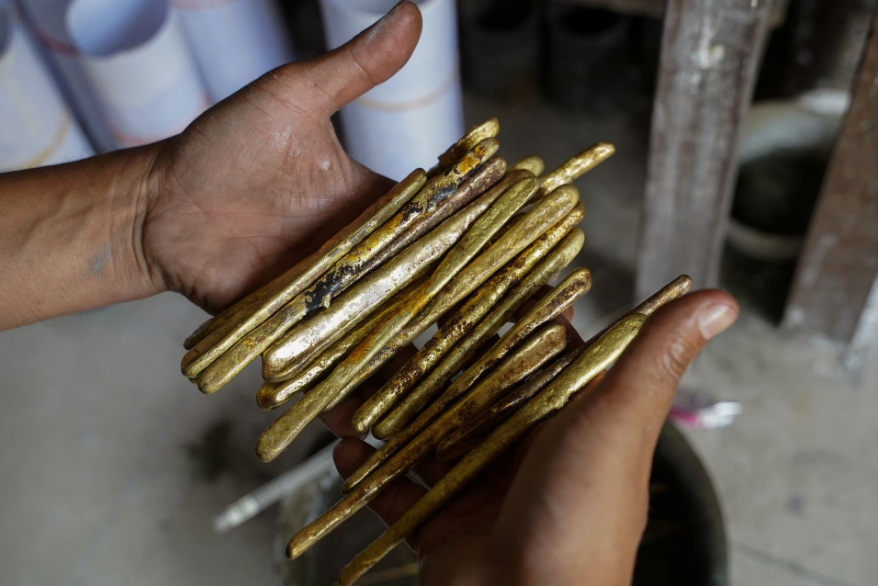 Melted bullet shells are cast into rods at the Angkor Bullet Jewelry workshop in Phnom Penh, Cambodia, March 29, 2023. Photo: Reuters