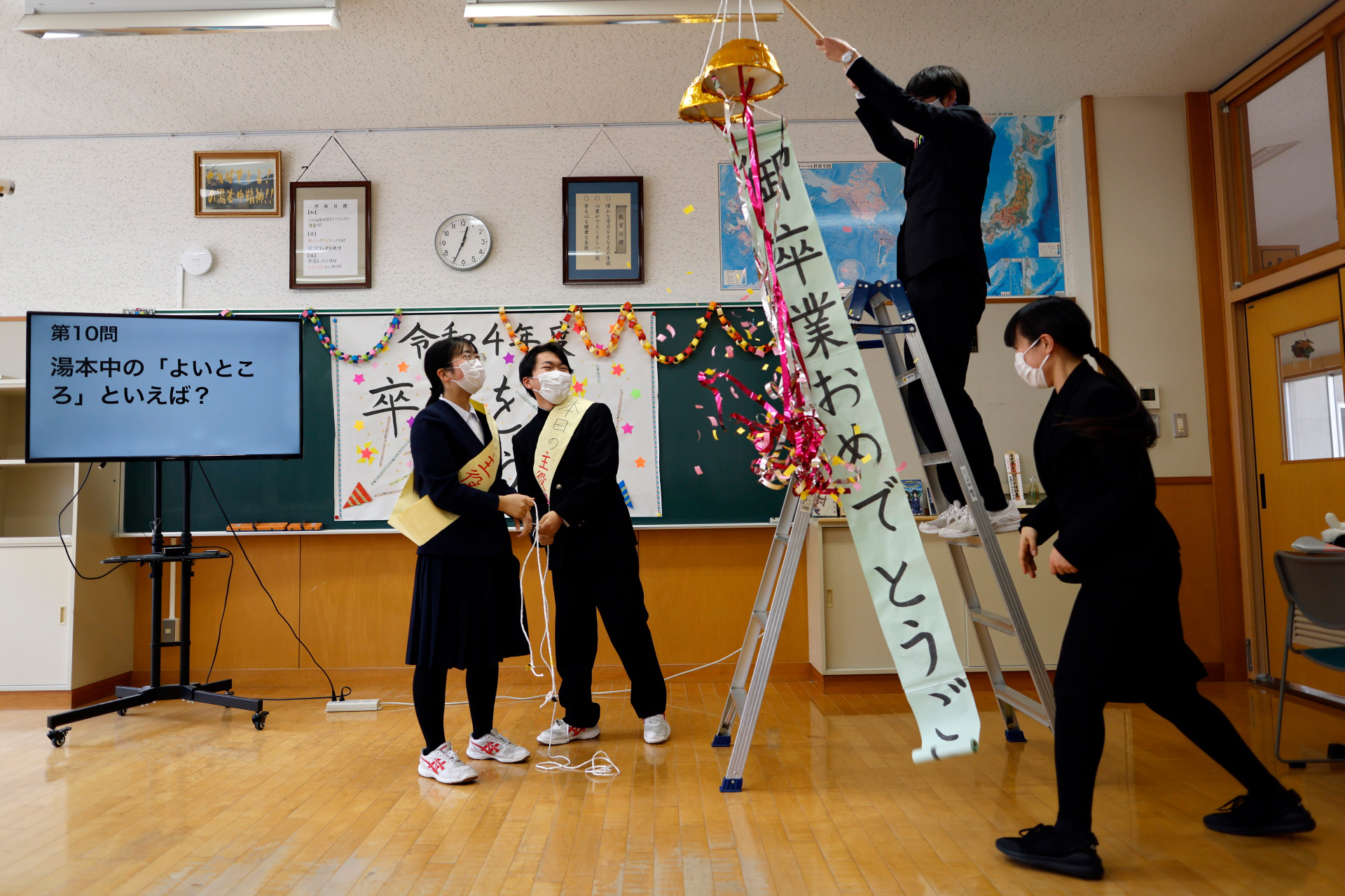 Eita, Aoi and their teachers attend a celebratory class before the students’ graduation and the institution's closing ceremony, in Ten-ei Village, Japan, March 9, 2023. Photo: Reuters
