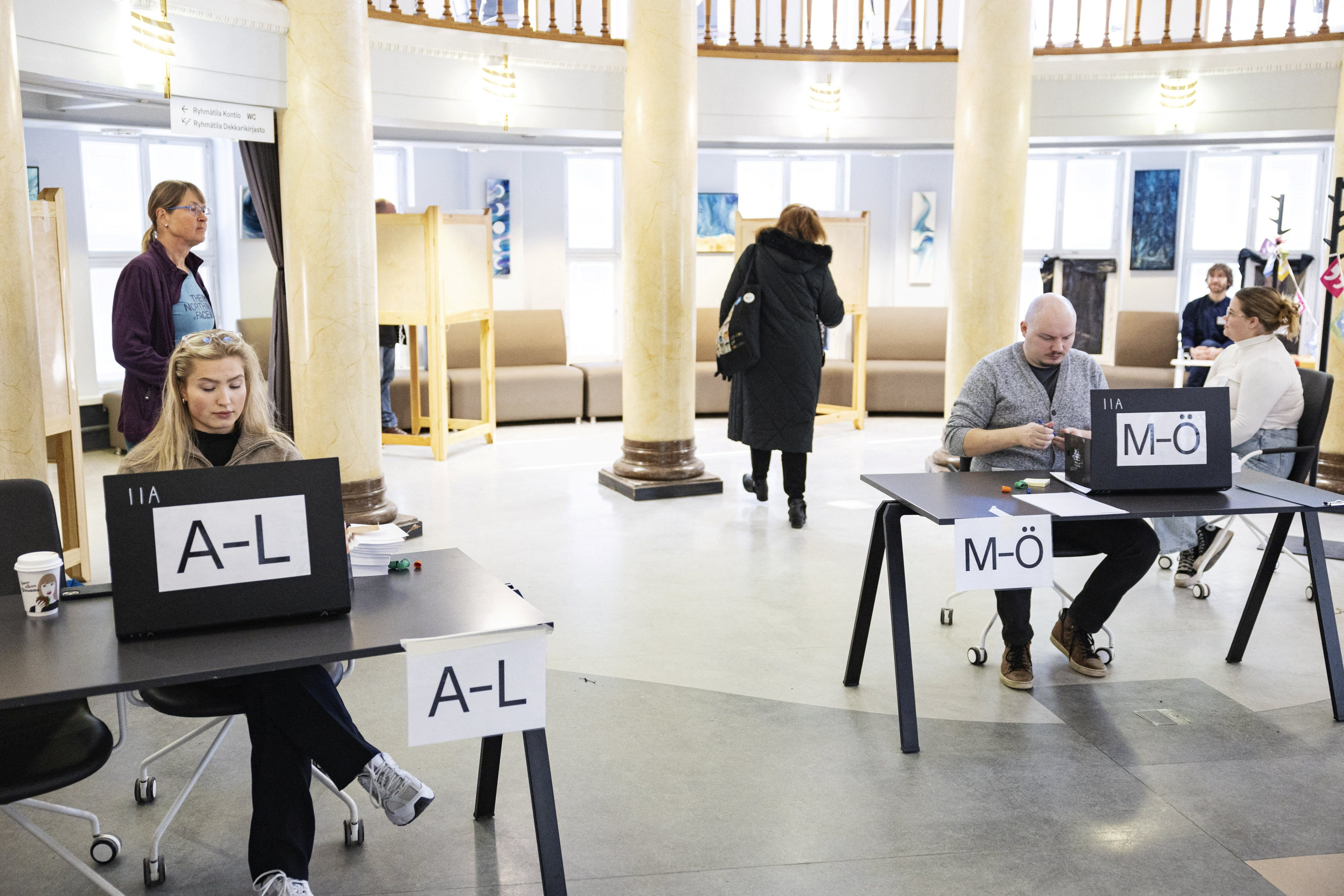 Election officials work as citizens attend voting during the parliamentary elections at the Kallio Library, in Helsinki, Finland, April 2, 2023. Photo: Reuters
