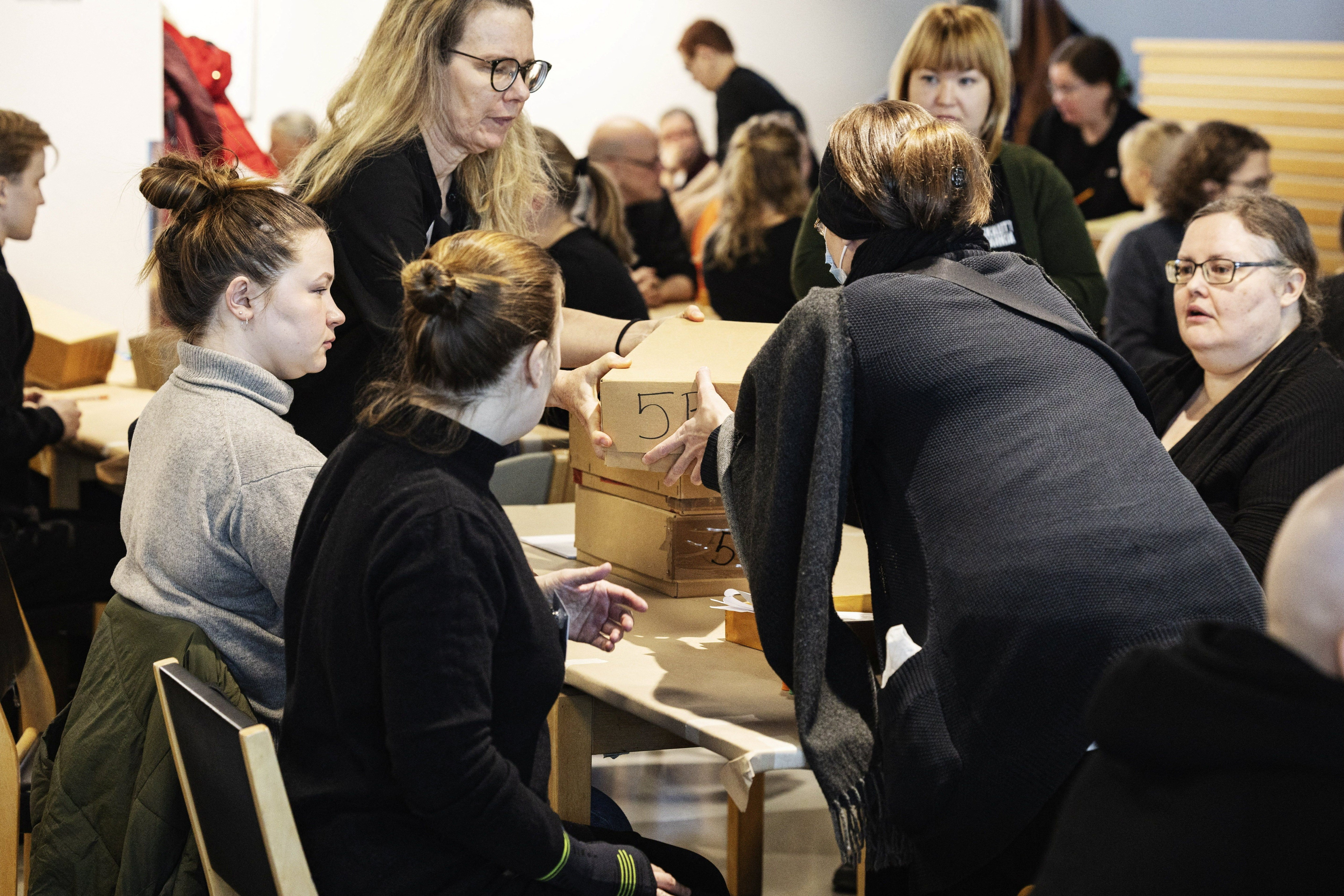 People work as the counting of the advance votes of the Finnish parliamentary elections continues at the Kallio administrative building in Helsinki, Finland, April 2, 2023. Photo: Reuters