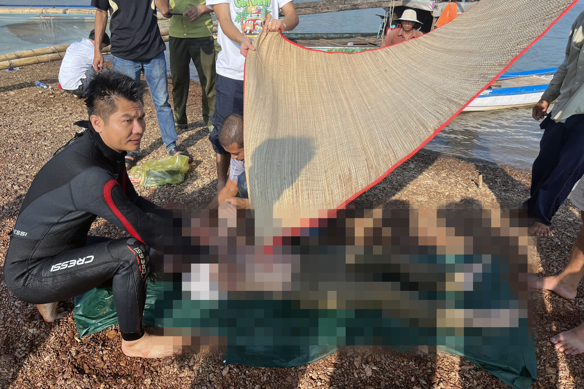 This supplied photo shows rescuers retrieving a victim in a drowning accident in Tri An Lake, Vinh Cuu District, Dong Nai Province, Vietnam, April 4, 2023.