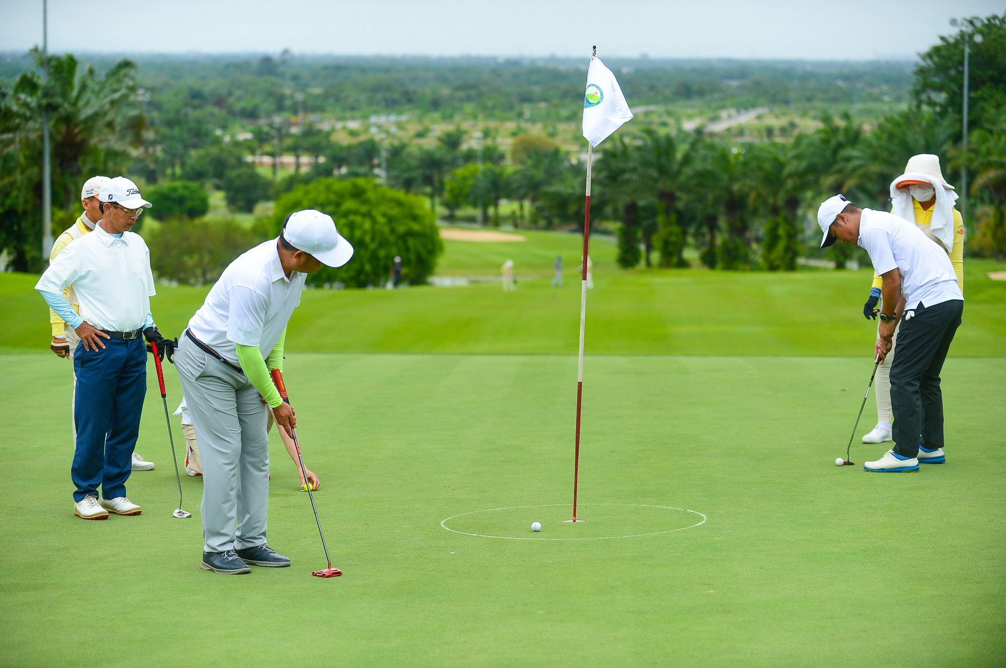 People play golf at a golf course in Vietnam. Photo: Quang Dinh / Tuoi Tre