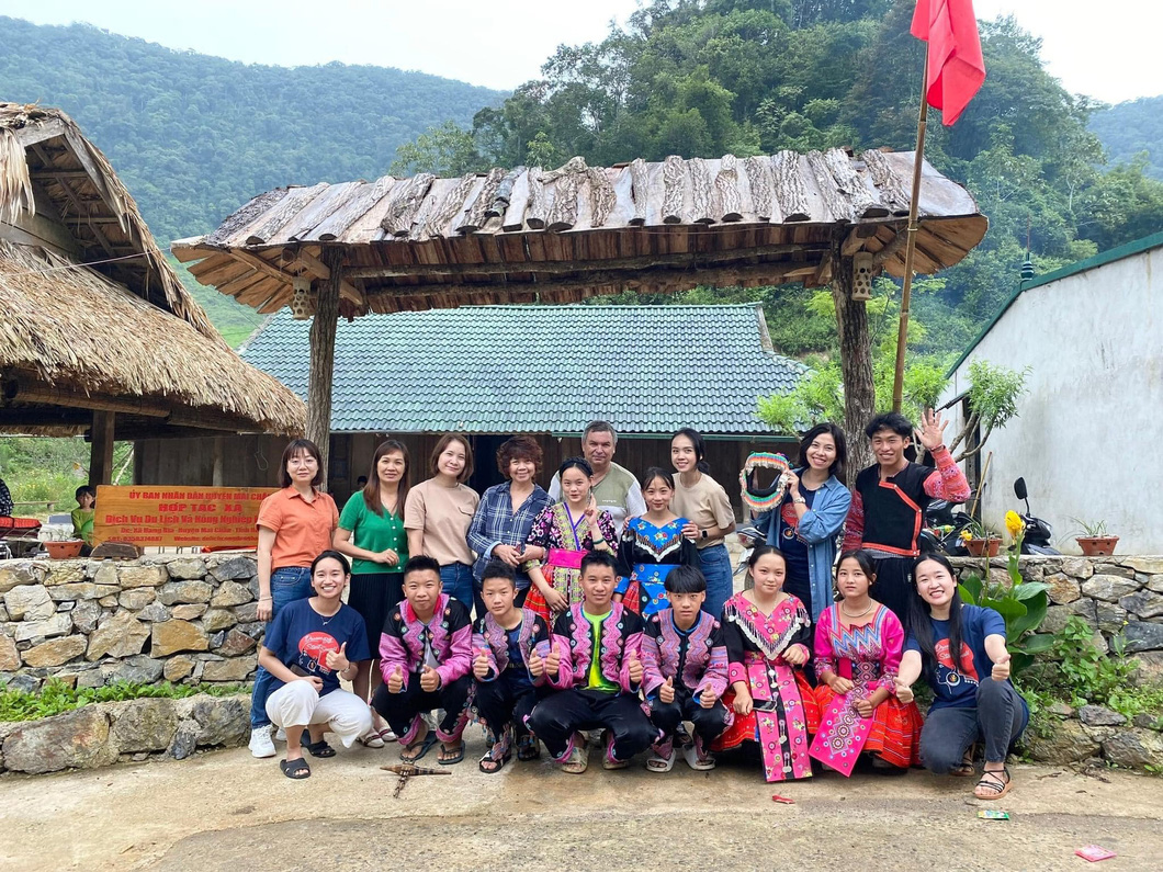 Visitors in ethnic minority clothing pose for a group photo at a tourist attraction in Hoa Binh Province, northern Vietnam. Photo: Supplied