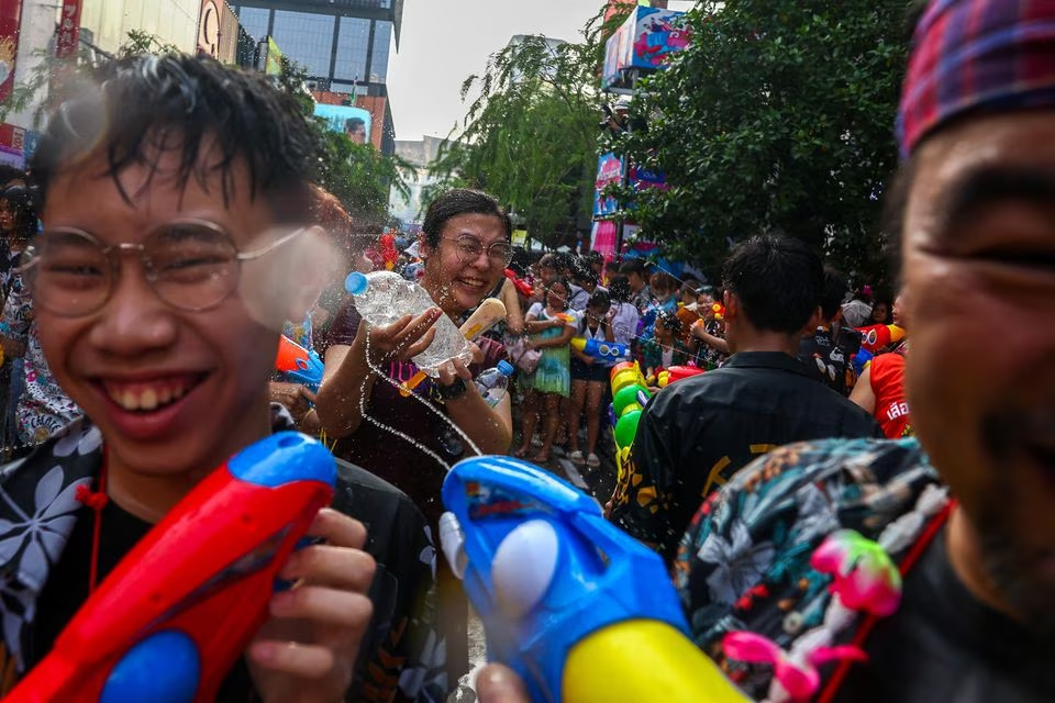 People play with water as they celebrate the Songkran holiday which marks the Thai New Year in Bangkok, Thailand, April 13. Photo: Reuters