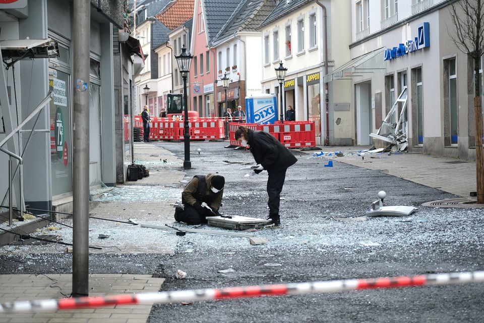 Law enforcement officers investigate the scene following an attack on bank ATMs in Ratingen, Germany, March 15, 2023. Courtesy of Achim Blazy/Handout via Reuters