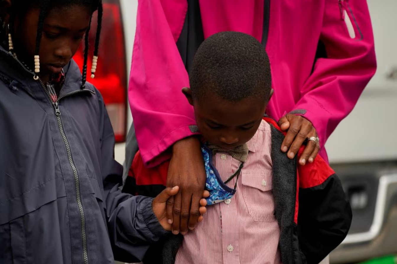 The Jacobs family prays during a vigil the day after a shooting during a teenager's birthday party at Mahogany Masterpiece Dance Studio in Dadeville, Alabama, U.S. April 16, 2023. Photo: Reuters